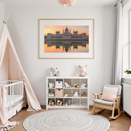 An Art Wall Room Mockup generated with AI for Print On Demand Seller. The mockup features a Scandinavian Style Nursery room with a framed photography print of the Budapest Hungarian Parliament at sunrise hanged on the wall