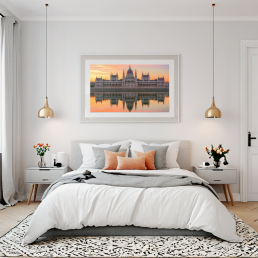 An Art Wall Room Mockup generated with AI for Print On Demand Seller. The mockup features a Scandinavian Style Bedroom with a framed photography print of the Budapest Hungarian Parliament at sunrise hanged on the wall
