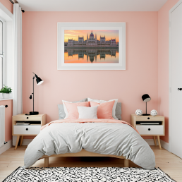 An Art Wall Room Mockup generated with AI for Print On Demand Seller. The mockup features a Scandinavian Style Kids Bedroom with a framed photography print of the Budapest Hungarian Parliament at sunrise hanged on the wall