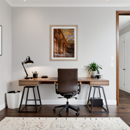 An Art Wall Room Mockup generated with AI for Print On Demand Seller. The mockup features a Modern and Minimalist Style Home Office Room with a framed photography print of the Strahov Monastery Library hanged on the wall