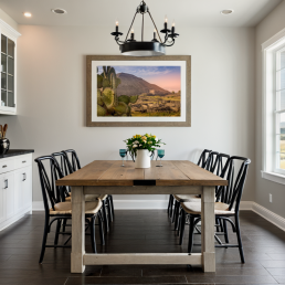 An Art Wall Room Mockup generated with AI for Print On Demand Seller. The mockup features a Modern Farmhouse Style Dining Room with a framed photography print of a the Teotihuacan Pyramids and Cactus at sunrise on the wall
